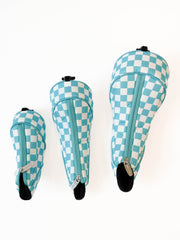 Three checkered headcovers on a white background