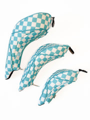 Three blue and white checkered golf club covers on a white background