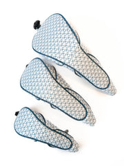 Three pairs of patterned golf headc on a white backgroundvers